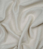 Draped Bampton Jasmine woven herringbone fabric demonstrating its soft handle, ideal for curtains, blinds and cushions.