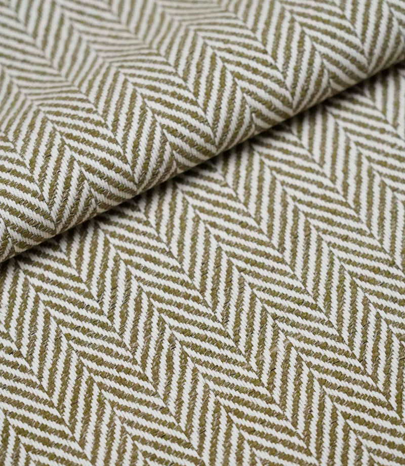 Folded Bampton Matcha woven herringbone fabric showing its soft texture and classic chevron design.