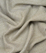 Draped Bampton Matcha woven herringbone fabric demonstrating its soft handle and elegant drape, suitable for curtains, blinds and cushions.