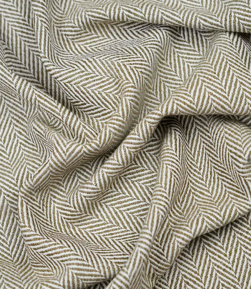 Draped Bampton Matcha woven herringbone fabric demonstrating its soft handle and elegant drape, suitable for curtains, blinds and cushions.