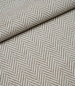 Folded Bampton Taupe upholstery fabric displaying the woven herringbone chevron pattern and durable textured finish, perfect for curtains and upholstery.