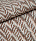 Folded Bampton Terracotta woven herringbone fabric showcasing its textured chevron weave, soft handle and durable upholstery weight for interior furnishing projects.