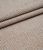 Layered Bampton Terracotta upholstery fabric displaying the repeating woven herringbone pattern, premium texture and versatile fabric suitable for cushions, curtains and upholstery.