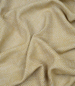 Draped Bampton Turmeric woven herringbone fabric demonstrating its soft handle and elegant drape, ideal for curtains, blinds and cushions.