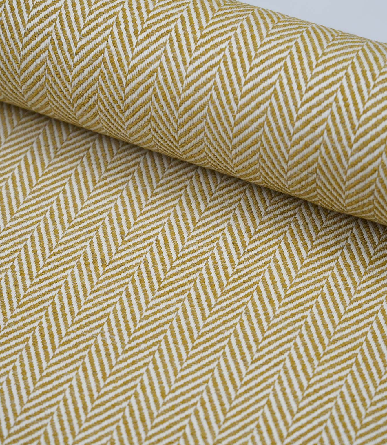 Wide view of Bampton Turmeric woven herringbone fabric showcasing the continuous chevron pattern across the fabric width.