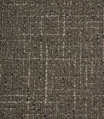 Close-up detail of Bellmere Slate upholstery fabric highlighting the intricate woven boucle texture and contrasting yarns.