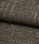 Rolled Bellmere Slate upholstery fire retardant fabric revealing the depth, durability and tactile boucle texture of the weave.