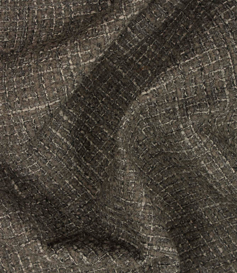 Bellmere Slate textured upholstery fabric draped naturally to demonstrate its soft handle, structure and dimensional woven finish.