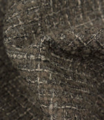 Macro detail of Bellmere Slate upholstery fabric showing the boucle yarns, woven texture and subtle tonal variation within the fabric.