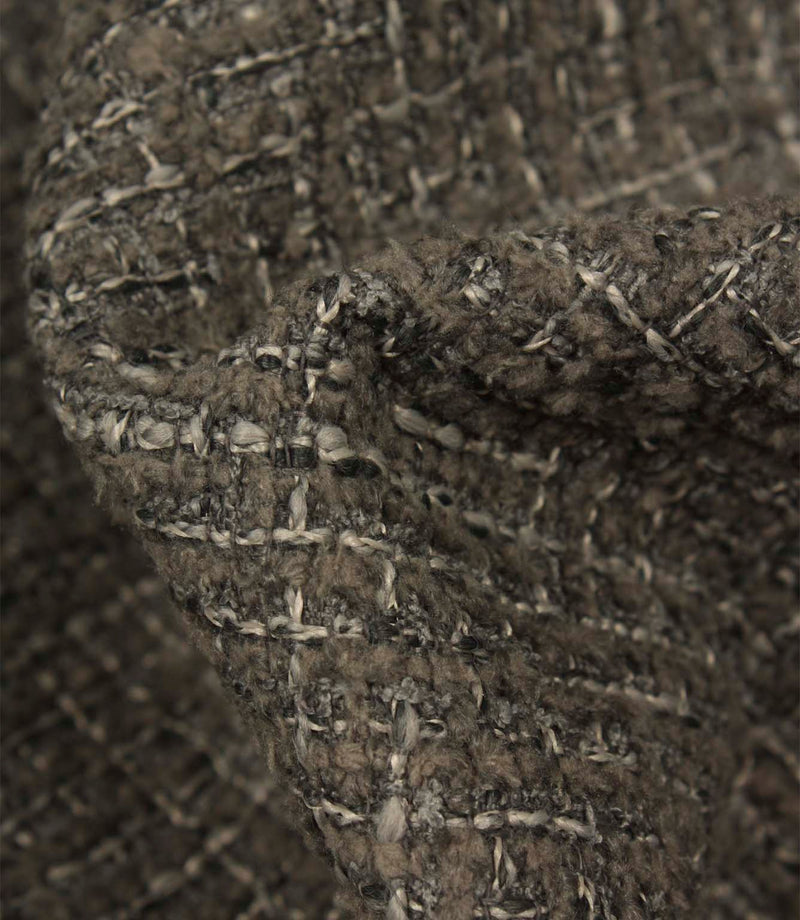 Macro detail of Bellmere Slate upholstery fabric showing the boucle yarns, woven texture and subtle tonal variation within the fabric.