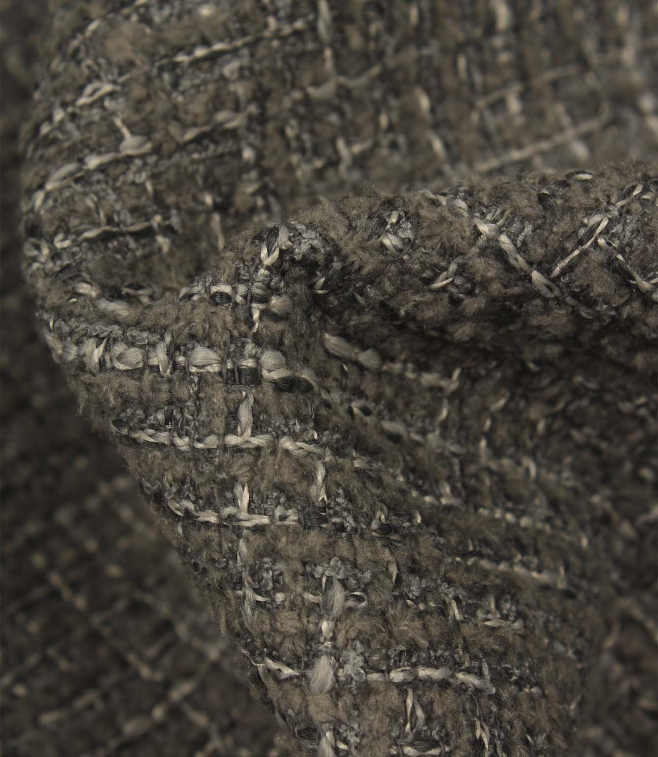 Macro detail of Bellmere Slate upholstery fabric showing the boucle yarns, woven texture and subtle tonal variation within the fabric.