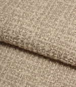 Rolled Bellmere Stone upholstery fire retardant fabric revealing the depth, durability and tactile boucle texture of the weave.