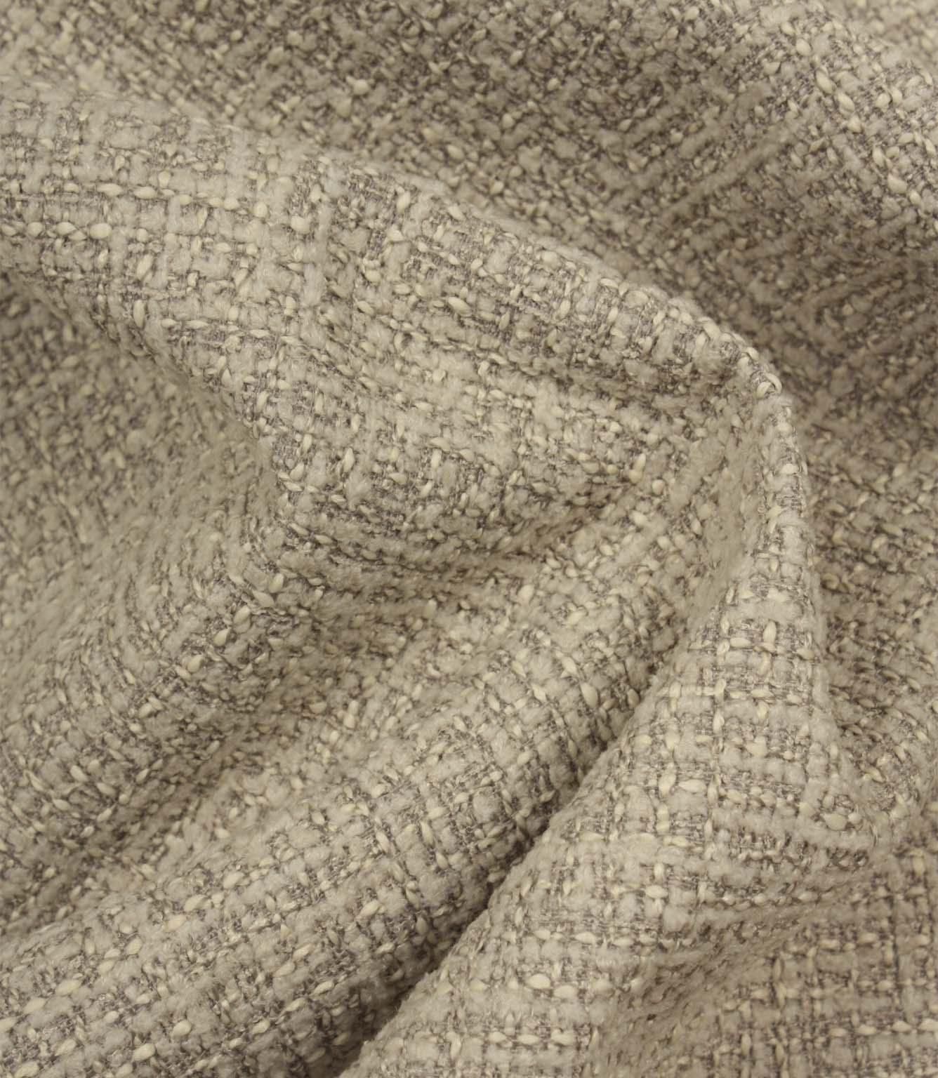 Bellmere Stone textured upholstery fabric draped naturally to demonstrate its soft handle, structured appearance and versatile woven finish.