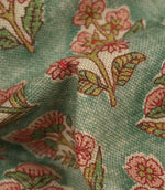 Detailed close-up of floral upholstery fabric showing the woven texture and intricate botanical print design.