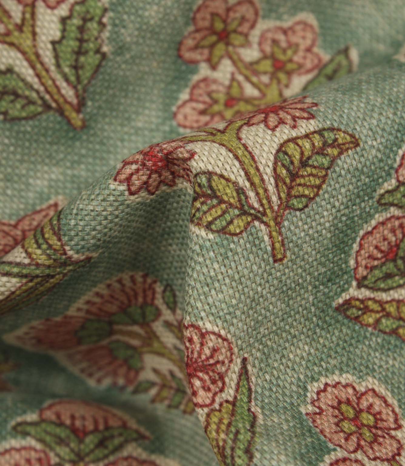 Detailed close-up of floral upholstery fabric showing the woven texture and intricate botanical print design.