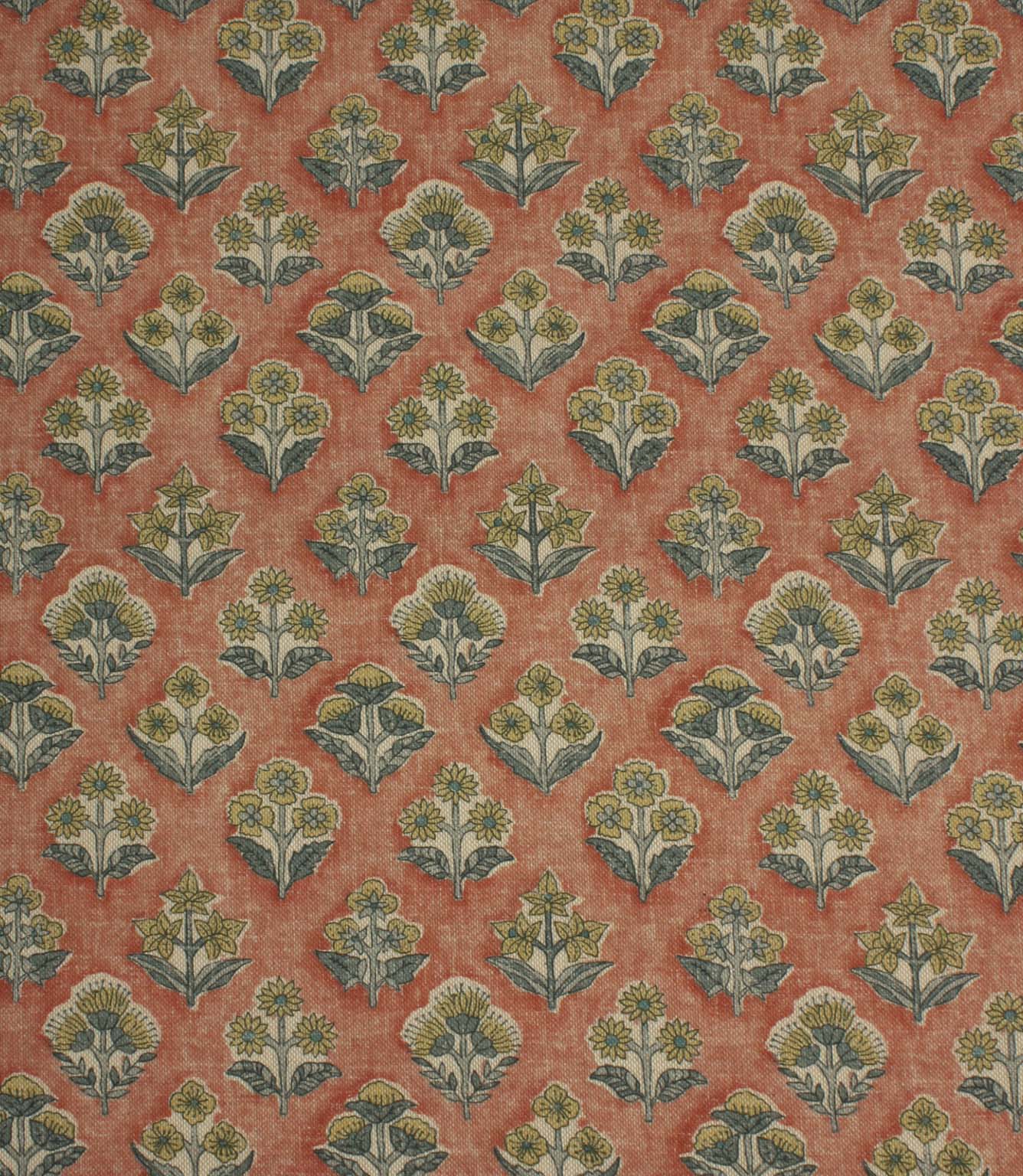Boho Blossom ditsy floral fabric featuring small-scale botanical motifs in soft mustard yellow and slate blue on a warm terracotta background.