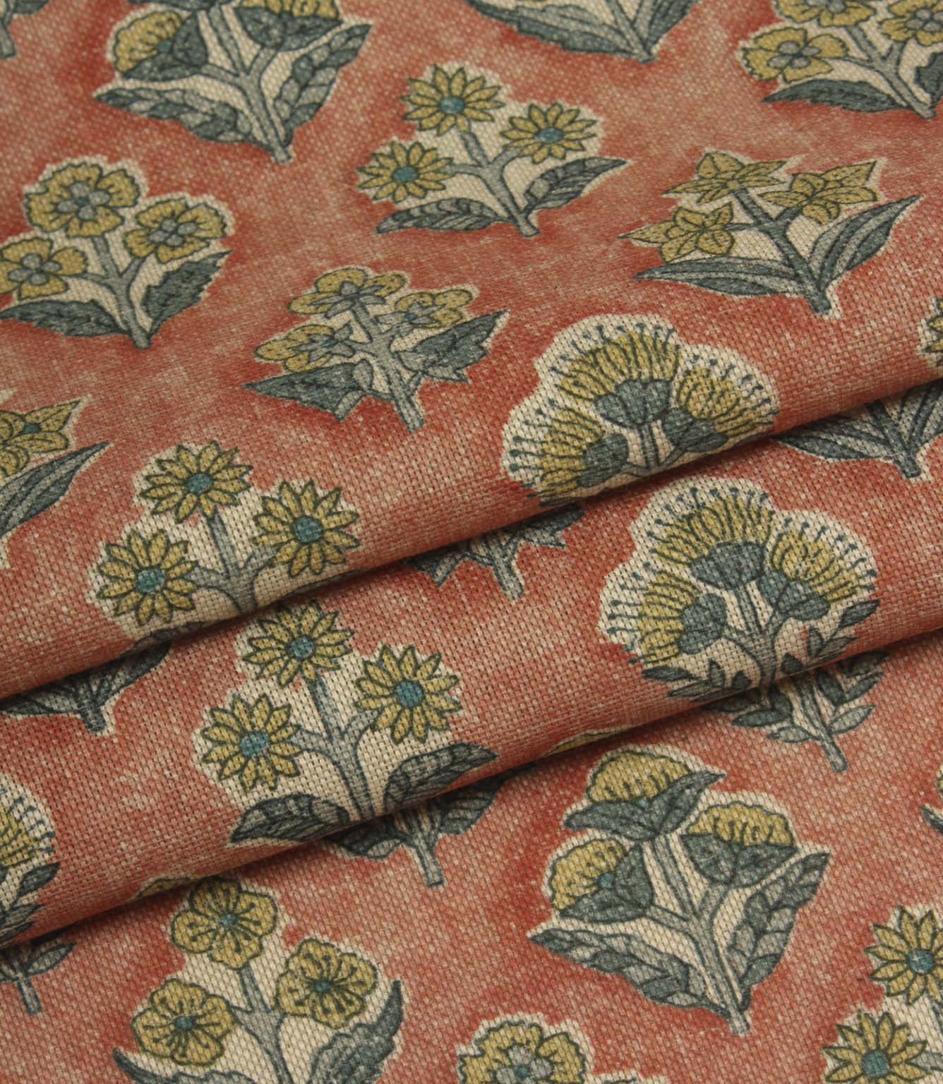 Folded Boho Blossom small-scale floral fabric highlighting the textured terracotta background and delicate botanical print.