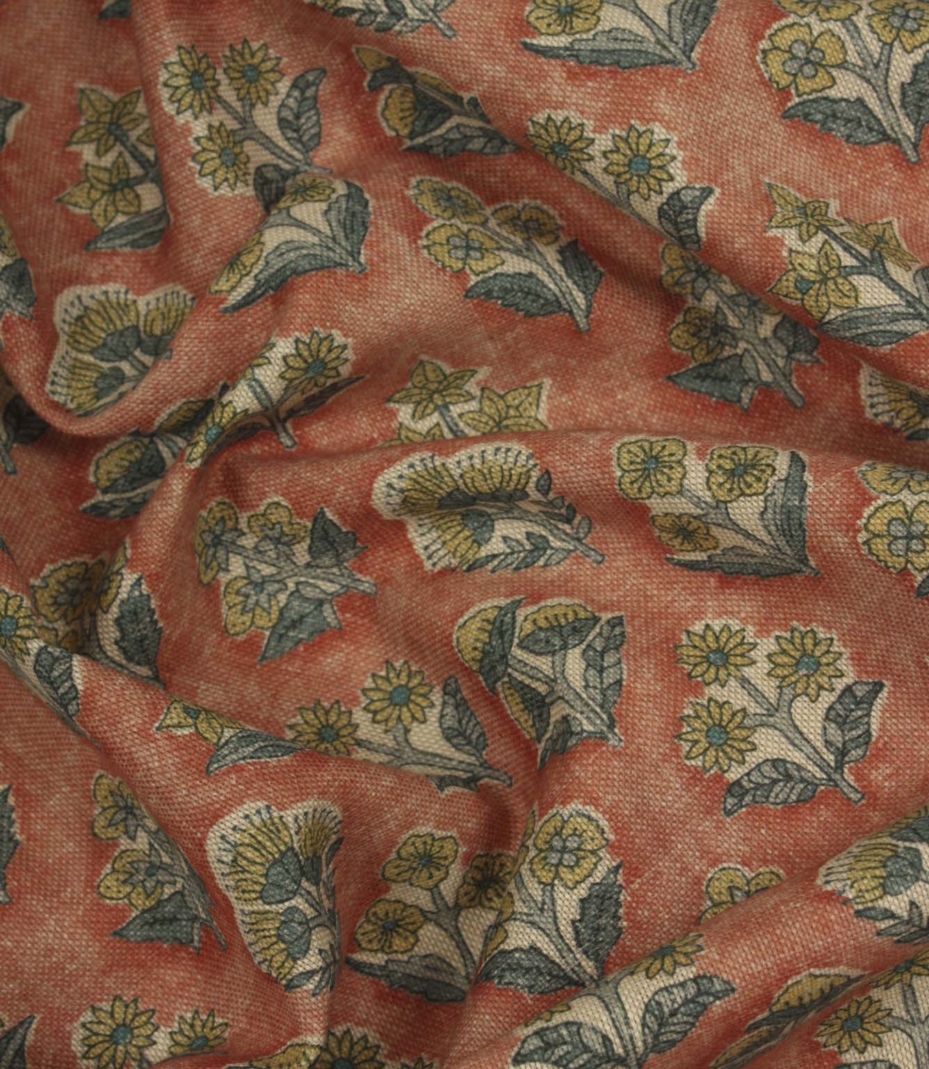 Draped Boho Blossom floral fabric with mustard yellow and slate blue botanical motifs across a warm terracotta woven surface.