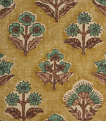 Close-up of Boho Blossom floral fabric showing detailed teal floral motifs and textured mustard yellow woven base.