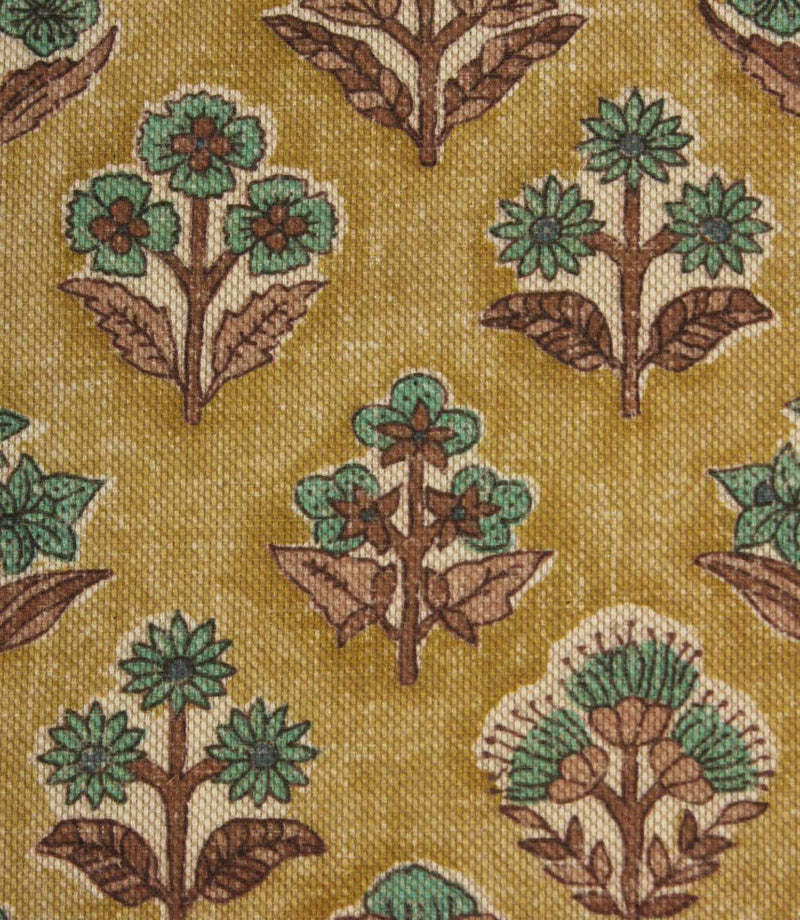 Close-up of Boho Blossom floral fabric showing detailed teal floral motifs and textured mustard yellow woven base.