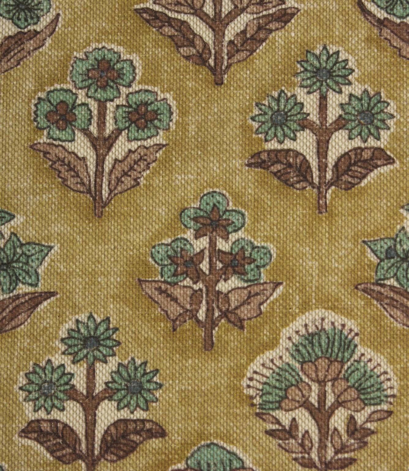 Close-up of Boho Blossom floral fabric showing detailed teal floral motifs and textured mustard yellow woven base.