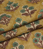 Folded Boho Blossom ditsy floral fabric highlighting the warm mustard background and teal botanical print.