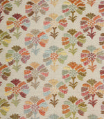 Close-up of Briar Sprig Jasmine contemporary woven foliage fabric showing intricate floral motifs in pink, green, blue, coral and golden tones on cream.
