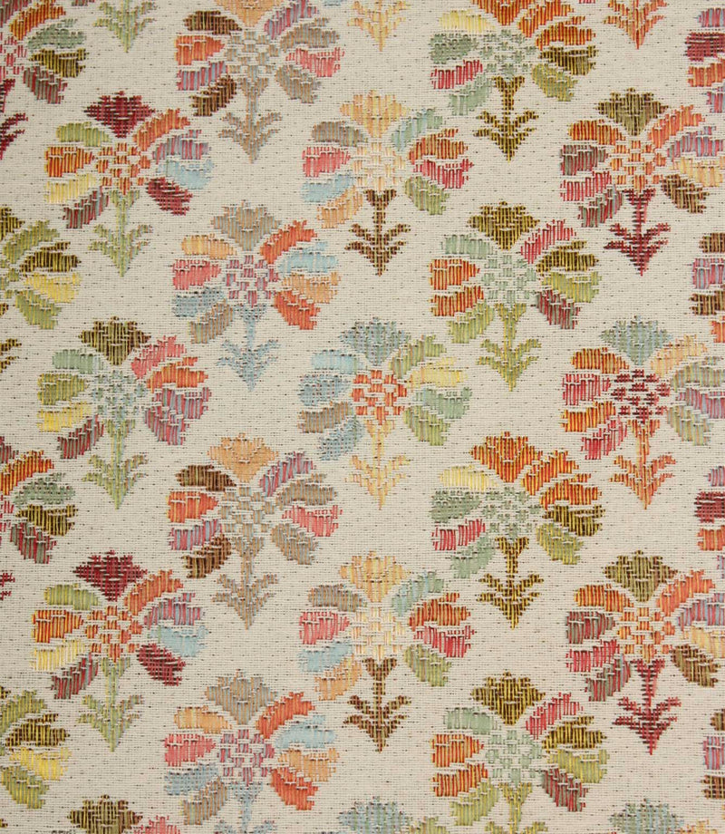 Close-up of Briar Sprig Jasmine contemporary woven foliage fabric showing intricate floral motifs in pink, green, blue, coral and golden tones on cream.
