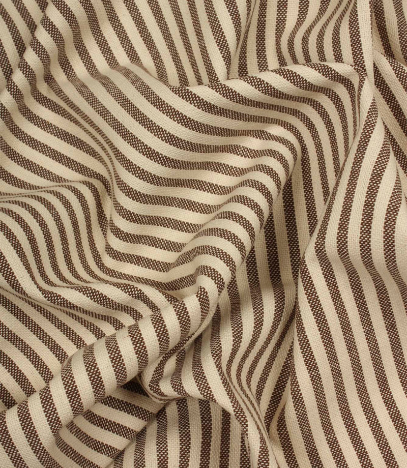 Draped Broadway Stripe Mocha striped fabric showing its soft handle, woven texture and elegant brown stripe pattern on a natural cream background.