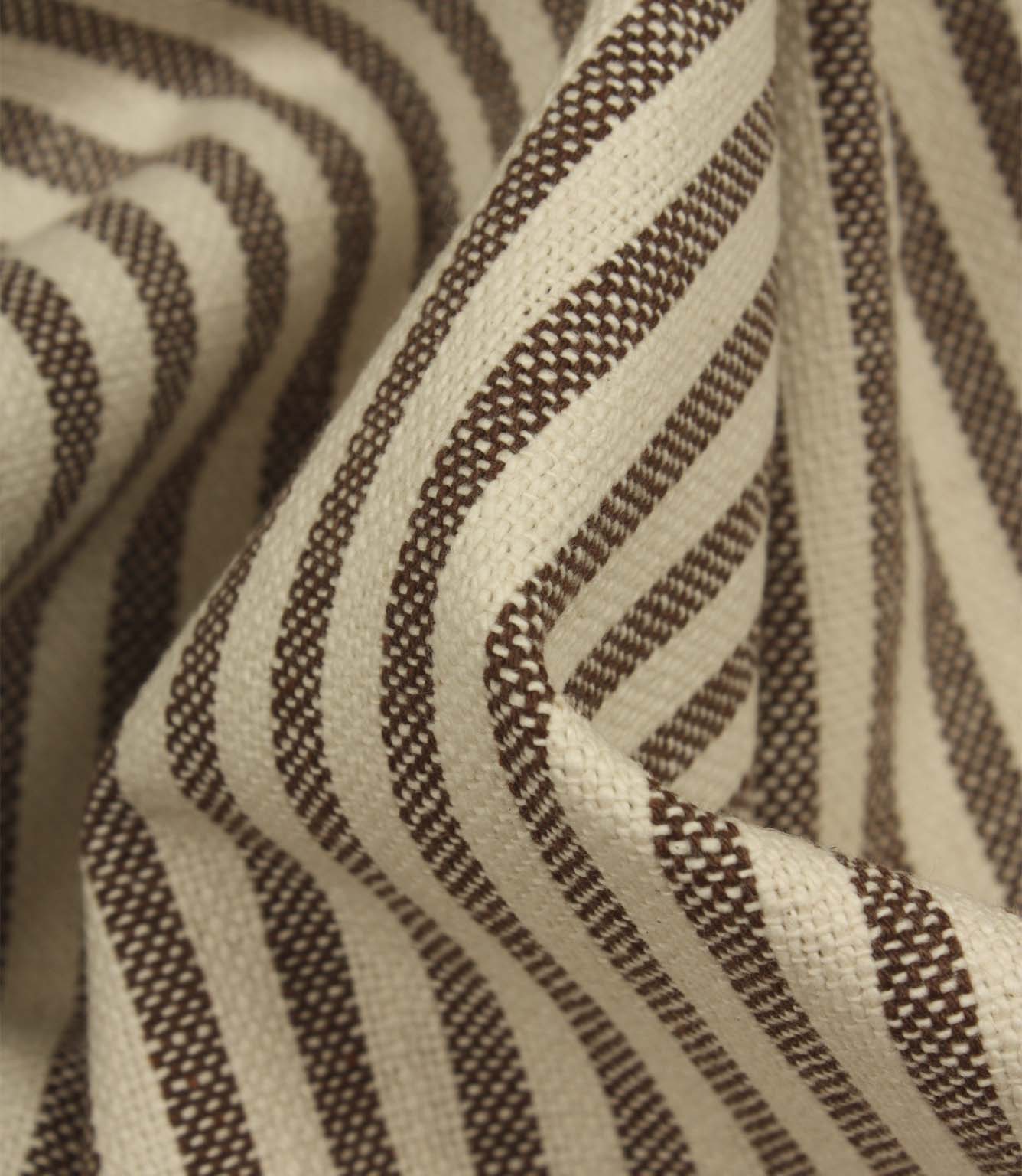 Detailed close-up of Broadway Stripe Mocha upholstery fabric featuring finely woven mocha brown stripes and a durable textured weave for interior projects.