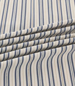 Brookhaven Nautica striped fabric arranged in soft folds, showcasing navy and slate blue vertical stripes, fine decorative dotted lines and woven-look texture.