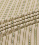 Close-up of Brookhaven Willow striped fabric in flowing folds, showcasing olive, sage and deep green vertical stripes with fine dotted detailing and textured weave.