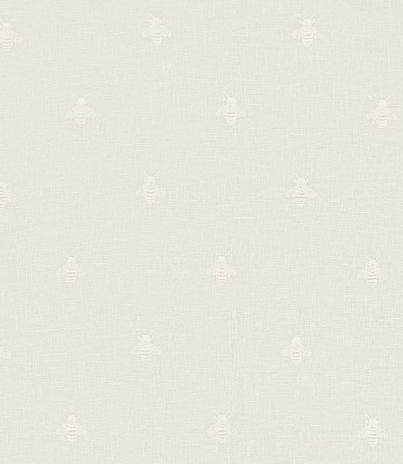 Bumblebee Ivory embroidered fabric featuring small, delicate white bees arranged in a scattered repeating pattern on an ivory linen-look woven background.