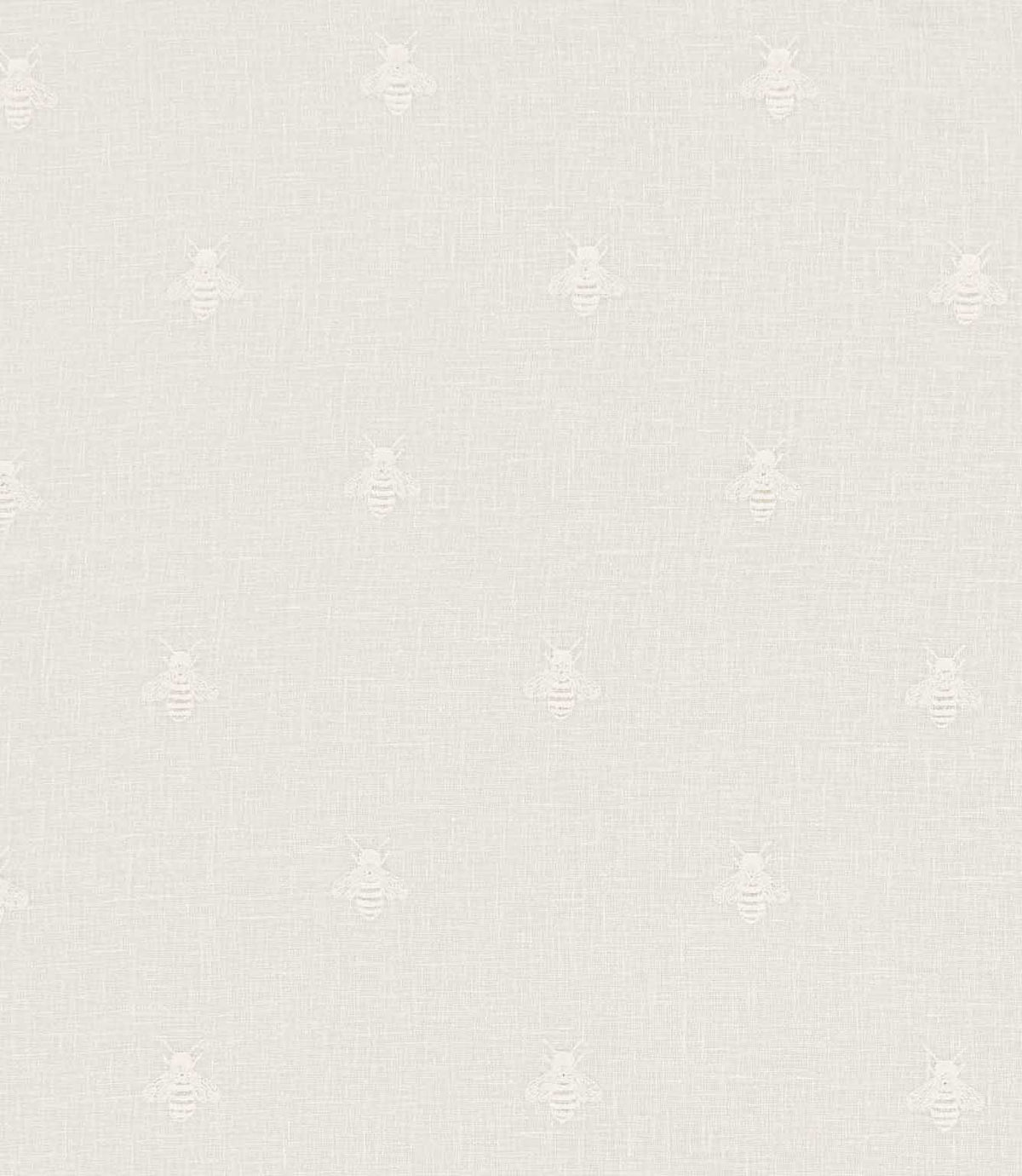 Bumblebee Ivory embroidered fabric featuring small, delicate white bees arranged in a scattered repeating pattern on an ivory linen-look woven background.