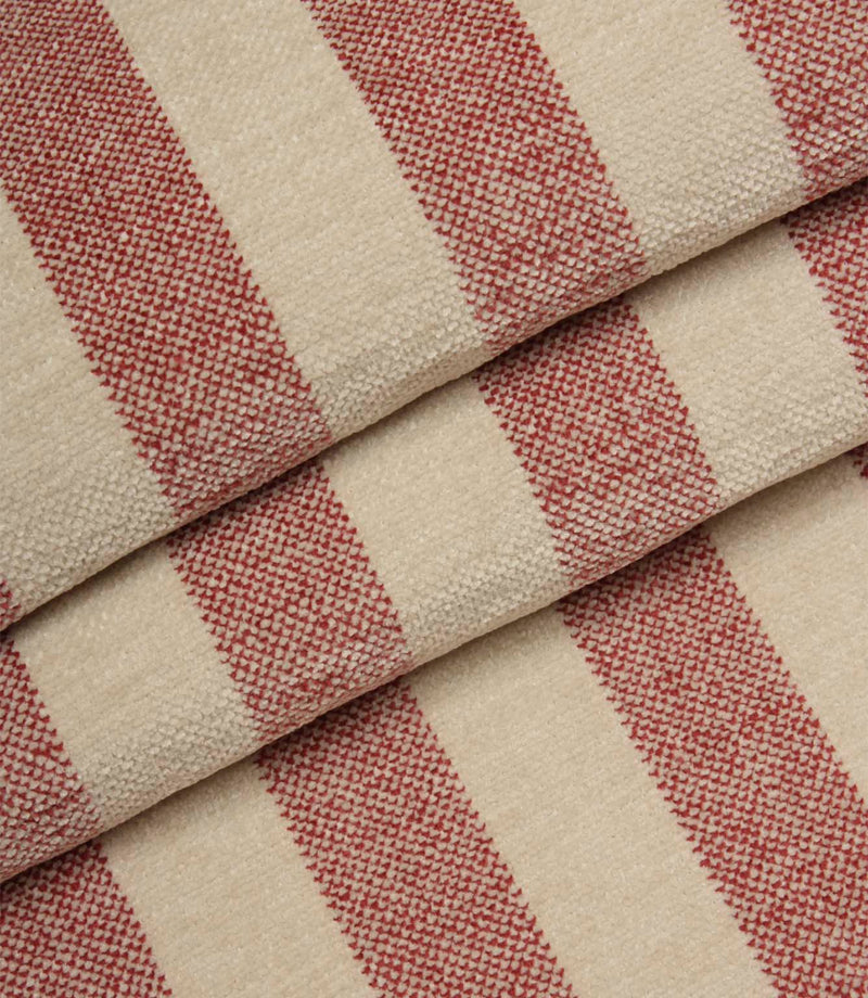 Folded Burleigh Stripe Rose fire retardant upholstery fabric displaying bold rose pink stripes and durable woven construction.