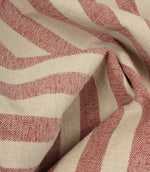 Draped Burleigh Stripe Rose striped upholstery fabric showing its soft velour-inspired texture, elegant stripe pattern and natural movement.