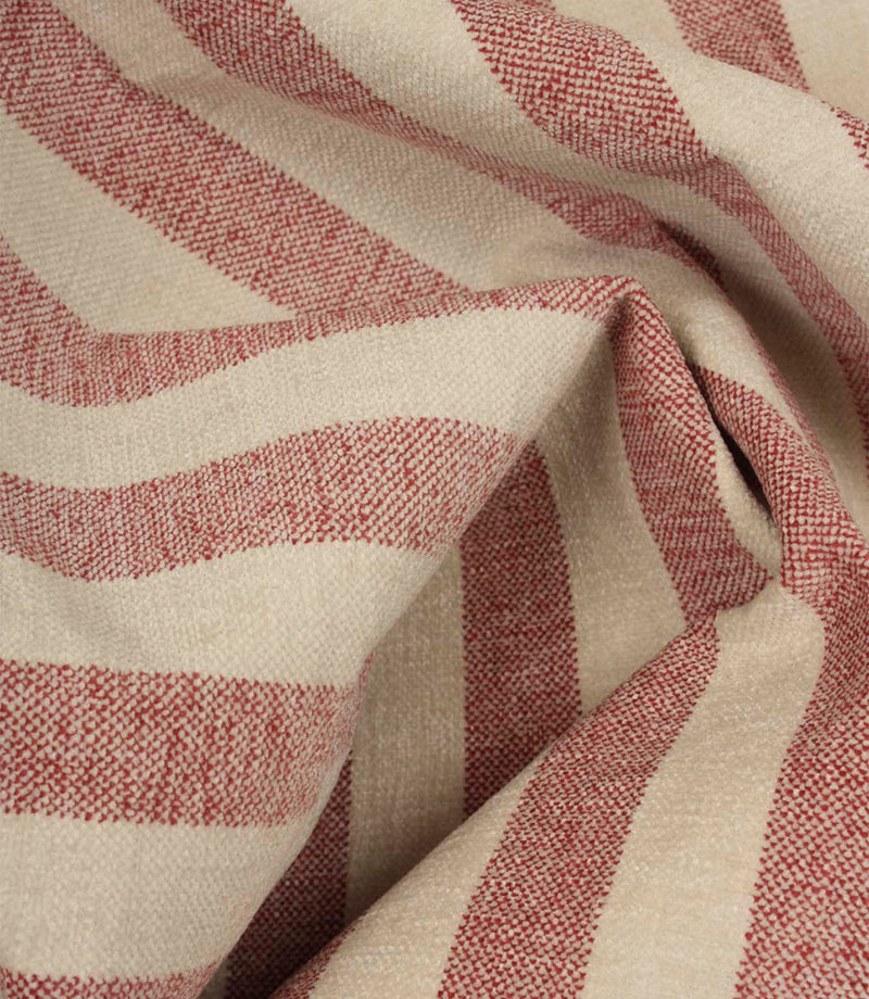 Draped Burleigh Stripe Rose striped upholstery fabric showing its soft velour-inspired texture, elegant stripe pattern and natural movement.