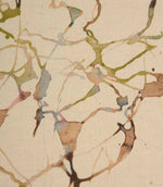 Close-up of Carrara cotton linen fabric showcasing the textured weave and artistic abstract pattern in green, pink, blue and beige shades.