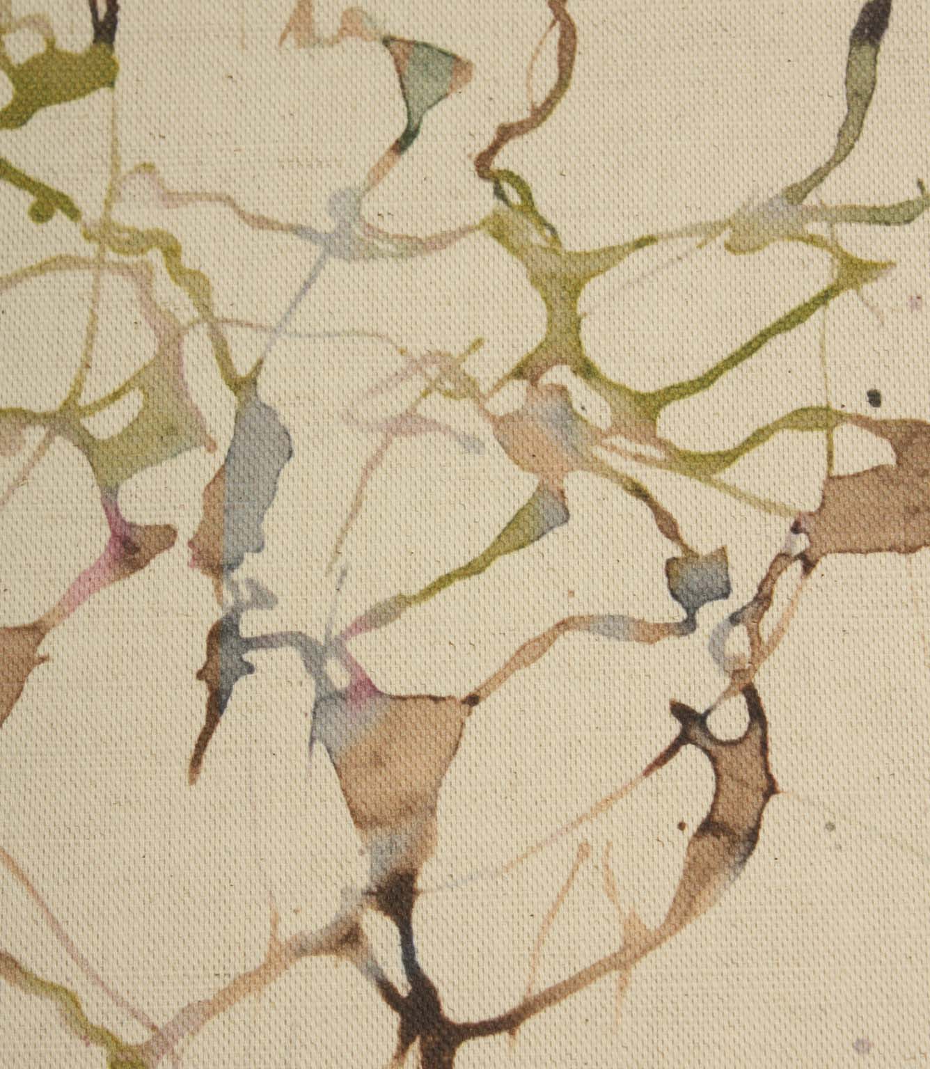 Close-up of Carrara cotton linen fabric showcasing the textured weave and artistic abstract pattern in green, pink, blue and beige shades.