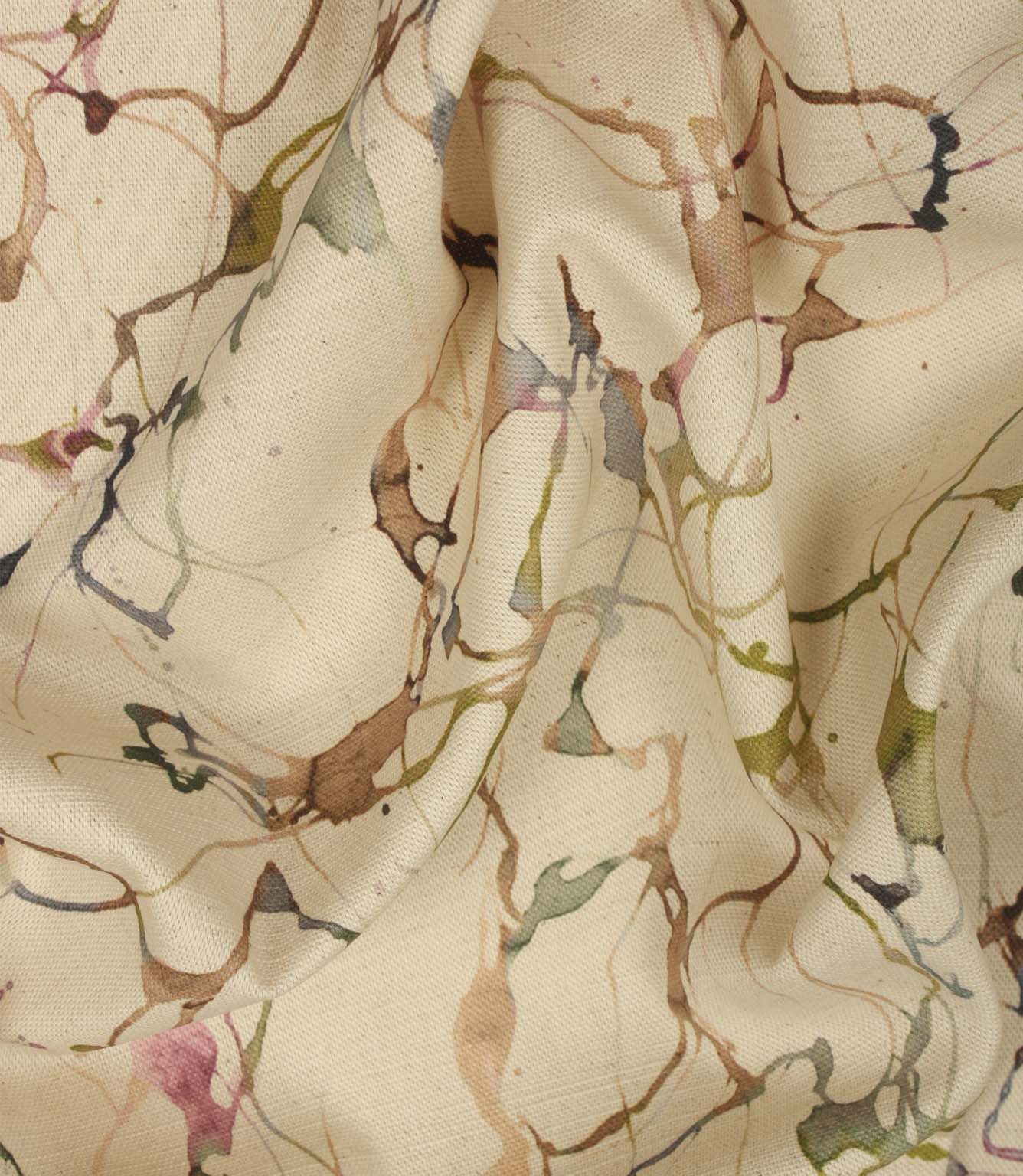 Draped Carrara cotton linen fabric showing the elegant handle and contemporary abstract pattern in green, pink, blue and neutral shades.