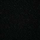 Close-up of Case Bouclé Noir upholstery fabric in deep black, showing its dense looped bouclé weave and richly textured surface.