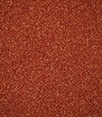 Close-up of Case Bouclé upholstery fabric in terracotta, showing its rich rust-orange colour and densely woven looped bouclé texture.