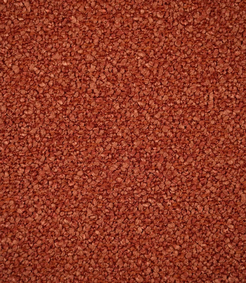 Close-up of Case Bouclé upholstery fabric in terracotta, showing its rich rust-orange colour and densely woven looped bouclé texture.