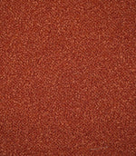 Full-frame view of Case Bouclé terracotta upholstery fabric, highlighting the plain design, warm earthy tone and tactile looped surface.