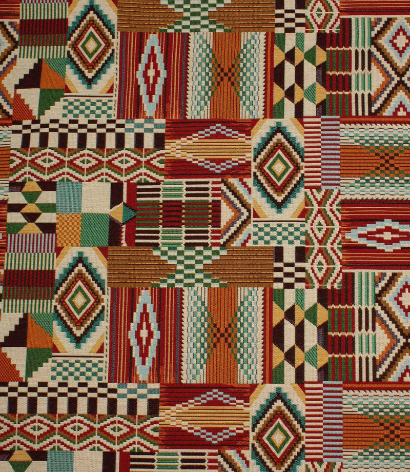 Multicoloured Southwestern-inspired upholstery fabric featuring patchwork geometric motifs in red, teal, green, ochre, black, and cream tones.