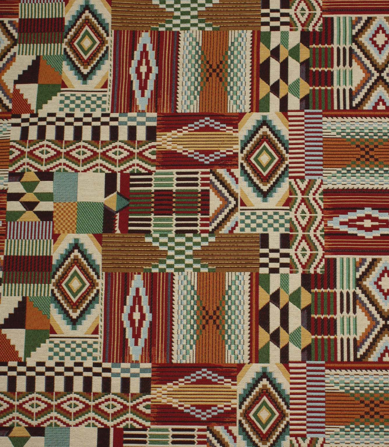 Multicoloured Southwestern-inspired upholstery fabric featuring patchwork geometric motifs in red, teal, green, ochre, black, and cream tones.
