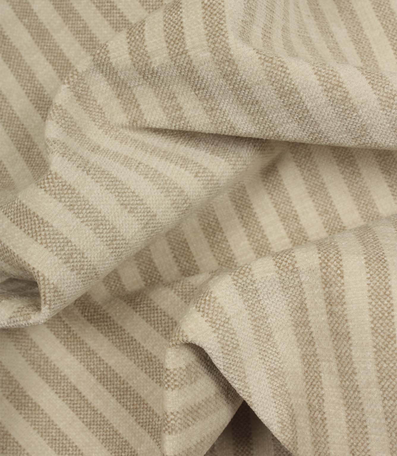Draped Cavendish Stripe Pebble striped upholstery fabric showing its soft handle, gentle movement and classic pebble beige stripe design.