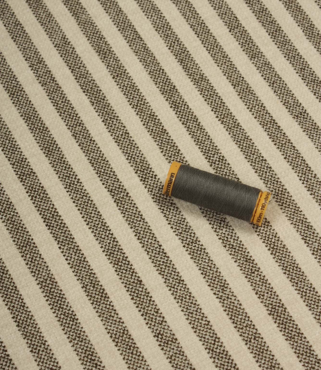 Cavendish Stripe Slate upholstery fire retardant fabric with coordinating slate grey thread, highlighting the fine stripe pattern and durable woven construction.