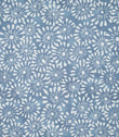 Close-up of Chamberry Bluebell fabric featuring a small-scale floral print of white daisy-like flowers with delicate petals and fine radiating details on a soft, muted blue background.
