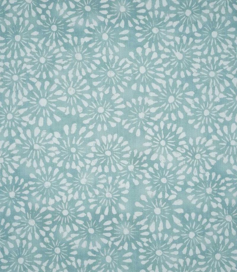 Close-up of Chamberry Duck Egg fabric featuring a delicate, small-scale floral print with white daisy-like flowers and fine radiating petals on a soft duck egg blue-green background.